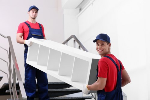 Removal team planning a house move in Catford outside a residential property