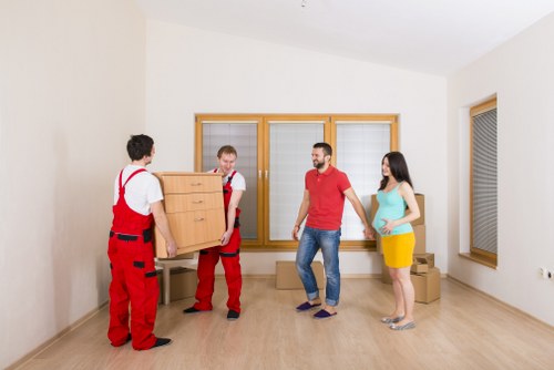 Packing and loading household items into a removal van
