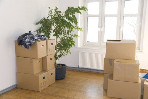 Movers handling items in a Catford flat or maisonette