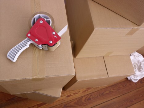 Packing and loading belongings into a moving van in Catford