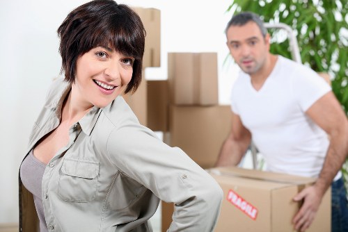 Office furniture and equipment being prepared for moving