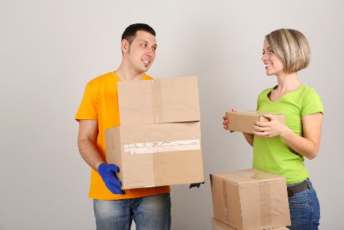 Preparing for a moving truck in Catford with boxes and furniture